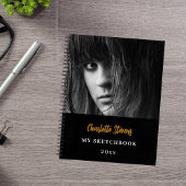 Schetsboekfoto zwart wit goud notitieboek