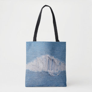 scheuren van denimtextuur met een gat en draden va tote bag