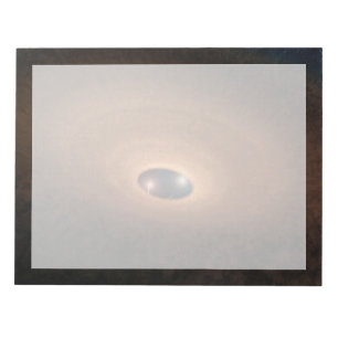 Schijf van stoffig materiaal overgebleven van ster notitieblok