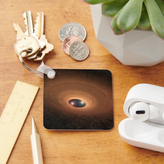 Schijf van stoffig materiaal overgebleven van ster sleutelhanger (Bureau)