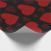 Schitterend rood hartpatroon op zwart cadeaupapier (Hoek)