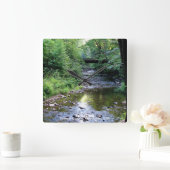 Schitterend zonlicht op de waterbergstroom vierkante klok (Huis)