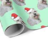 Schnauzer draagt een Santa Hat Cadeaupapier (Rol Hoek)