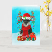 Schnauzer in de sneeuw met kerstcadeaus kaart (Gele Bloem)