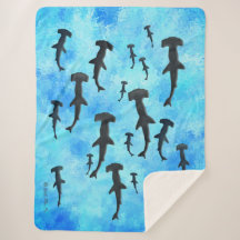 School of Hammerhead Sharks in Silhouette