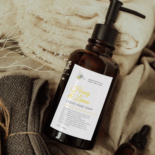 Schoonheidshoning bij geel vloeibaar hand zeep lab wijn etiket