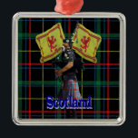 Schotse piper op tartan metalen ornament<br><div class="desc">Funny dog character gekleed als een Schotse doedelzak met een rode kilt op een groene  tartan gestreepte achtergrond en patriottische leeuw ongebreidelde vlaggen van Schotland en blauw Schotland. Bezoek de VINTAGEPRINTS STORE voor bijpassende producten en meer leuke dierenkaraktercollages.</div>