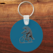 Schubdier rijdt op fiets, grappige fietsdier, fiet sleutelhanger (Voorkant)