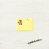 Schudde leeuw in het gras met ladybug post-it® notes (Op bureau)