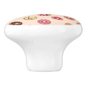 Schuddecoratieve donuts op roze keramische knop (Zijkant)
