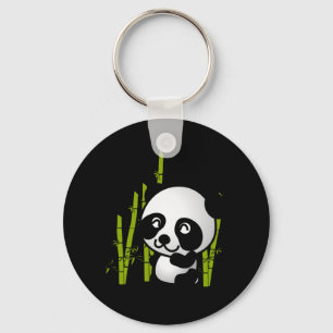 Schuif zwart-wit panda-beer in een bamboegroef. sleutelhanger