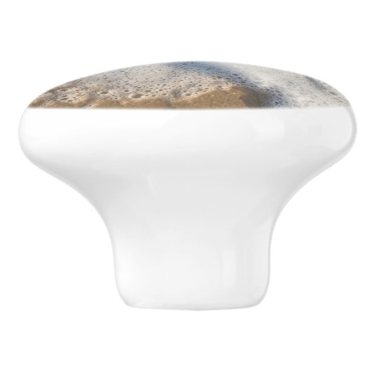 Schuimschuim op het strand keramische knop (Zijkant)