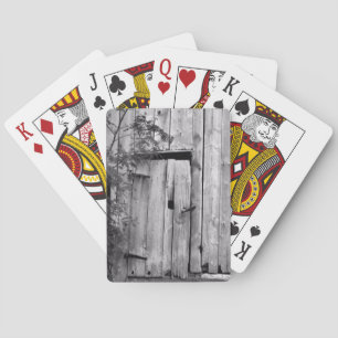 Schuurdeur in zwart-wit pokerkaarten