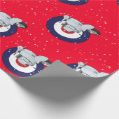 Scooter op rode omhulling met vallende sneeuw cadeaupapier (Hoek)