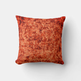 Scratches op krassen op een licht gevlekt koraal kussen