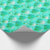 Seafoam groene kruipers op aqua cadeaupapier (Hoek)