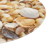 Seashell gestructureerde zomer strand achtergrond. snijplank (Hoek)