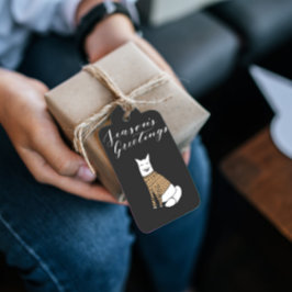 Seizoenen met een zwarte kerstcadeautas van Wolf Cadeaulabel