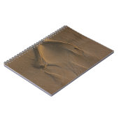 Selectieve focusfoto van zand notitieboek (Linkerzijde)