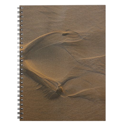 Selectieve focusfoto van zand notitieboek (Voorkant)