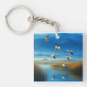Serene natuur meer scène met vliegende kraanvogel sleutelhanger
