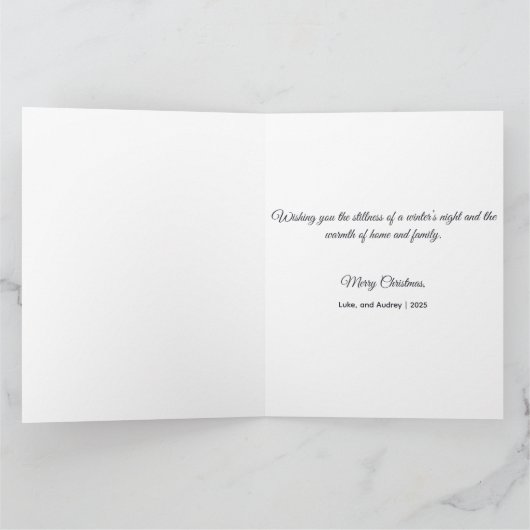 Serene snowy landscape illuminated by lit trees kaart (Binnen)