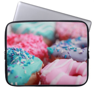 SHALLOW FOCUS FOTOGRAPHY OF ASSORTED DOUGHNUTS WI LAPTOP SLEEVE