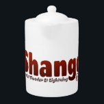 Shango Theepot<br><div class="desc">Met de naam "Shango" in donkerrode tint kleur samen met zijn titel en nummer,  dit stuk voegt een unieke flair aan uw collectie. Het is meer dan alleen kleding; het is een gespreksstarter die je individualiteit en waardering voor cultureel erfgoed laat zien.</div>