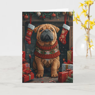 Shar Pei-hond met kerstcadeaus bij de open haard Kaart