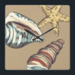 Shell Trio op Khaki Vierkante Klok<br><div class="desc">Megan Meagher staat bekend om haar eenvoudige kunstwerken. Dit is een geweldig afbeelding decoratieve kunst die het leven van het zee vangt met een gele zeester en een blauwe en rode kegelschelp. Profiteer vandaag van deze fijne kunstdruk op de Khaki-kleur op uw Zazzle-product.</div>