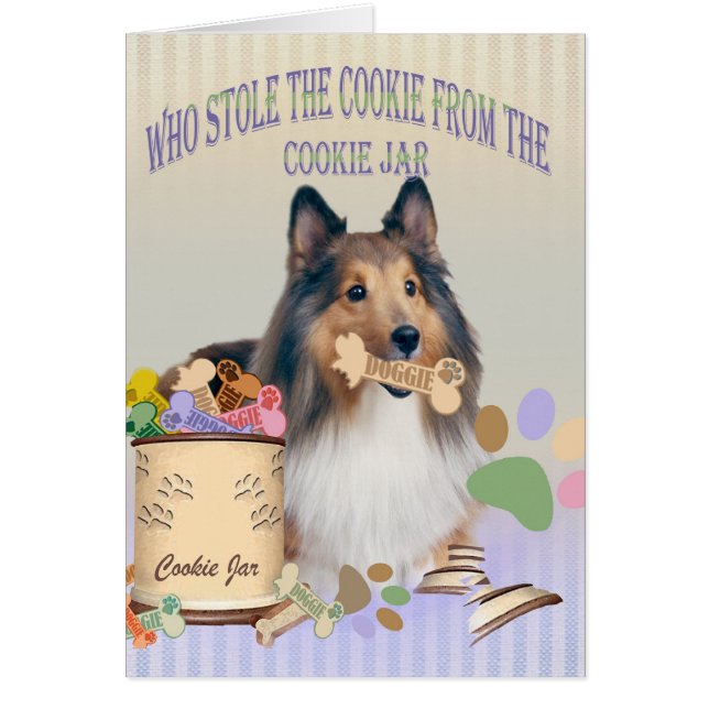 Sheltie houdt het koekje van de kaarten van de koe (Voorkant)