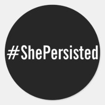 #ShePersisted, witte tekst op zwarte stickers