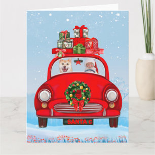 Shiba Inu Dog in auto met kerstman Kaart