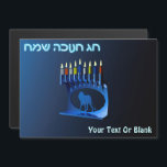 Shiny Blue Chanukkah Menorah<br><div class="desc">Een vernieuwer,  metallisch,  blauw Chanukkah-menorah,  met een leeuw in silhouet,  tegen een donkere,  nachtelijke achtergrond. Alle negen kaarsen zijn verlicht. Hebreeuwse tekst met de tekst "Chag Chanukkah Sameach" (Happy Hanukkah) staat ook in blauw en wit gloeiend. Voeg je eigen aanvullende tekst toe.</div>