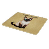 Siamese kat op oud papier snijplank (Hoek)
