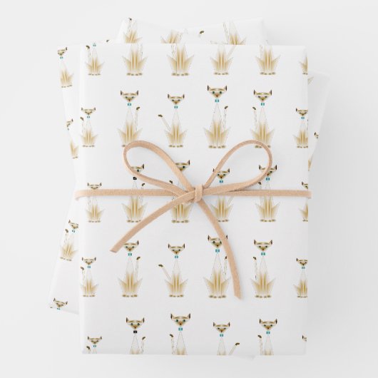 Siamese katten verpakken papieren vellen (In situ)