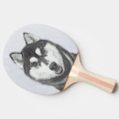 Siberische Husky (zwart en wit) schilderende hond  Tafeltennisbatje (Zijkant)