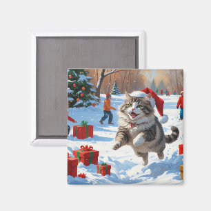 Siberische kat die rent in de sneeuw met een kerst magneet