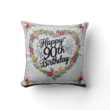 Sierkussen "Nine Decades of Joy": Vier een L