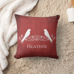 Sierkussen van rode bloemen