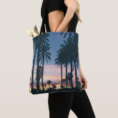 Silhouette of houses beside palm trees and pathway tote bag (Dichtbij)