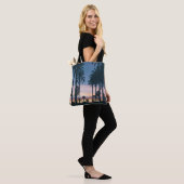 Silhouette of houses beside palm trees and pathway tote bag (Op model)
