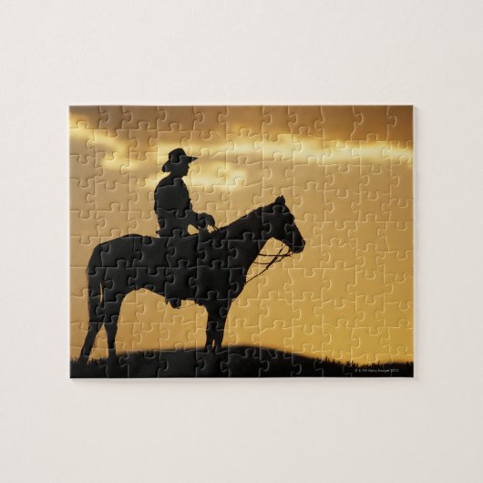 Silhouette van cowboy op horseback bij zonsonderga legpuzzel (Horizontaal)