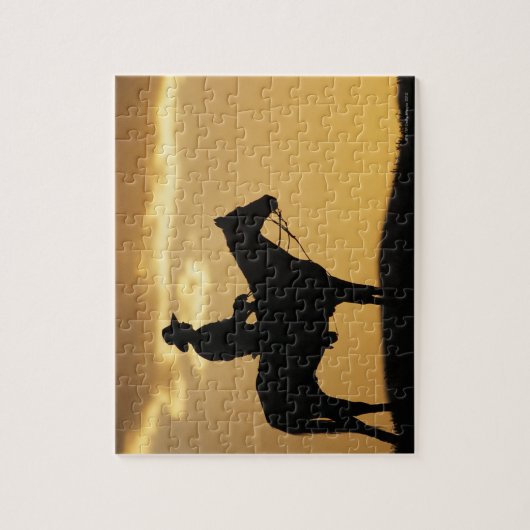 Silhouette van cowboy op horseback bij zonsonderga legpuzzel (Verticaal)