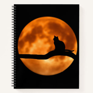 Silhouette van een zwarte kat in een boom notitieboek