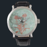 Silhouette van Rode Bloemen op Blauwgroen Achtergr Horloge<br><div class="desc">Drie rode bloemen contrasteren tegen een blauwgroen achtergrond in dit schilderij van Megan Meagher. Een silhouet van een andere bloem leunt naar links van de druk. Een eenvoudig stuk met veel aan de hand. Dit zou een leuk cadeau zijn voor een vriend of geliefde die van kunst houdt!</div>
