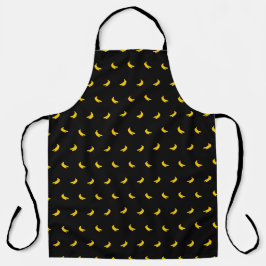 Silhouetten van kleine gele bananen op zwart schort