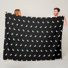 Silhouetten van kleine witte bananen op zwart fleece deken