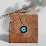 Silver Evil Eye Ketting - Beschermingssymbool<br><div class="desc">Ons kwaadaardige ketting is ideaal voor diegenen die op zoek zijn naar een unieke mix van mode en spiritualiteit. Gemaakt met liefde en aandacht voor detail, is dit sieradenstuk geschikt voor dagelijkse draag of speciale gelegenheden. Omarm de oude symboliek van het boze oog en zijn beschermende kwaliteiten met dit prachtige...</div>