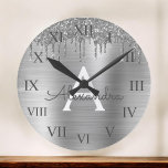 Silver Glitter Brushed Metal Monogram Name Ronde Klok<br><div class="desc">Silver Faux Foil Metallic Sparkle Glitter Brushed Metal Monogram Name and Initial Luxury Wall Clock. This makes the perfect sweet 16 birthday,  wedding,  bridal shower,  verjaarary,  baby shower or bachelorette party gift for someone that loves glam luxury and chic styles.</div>